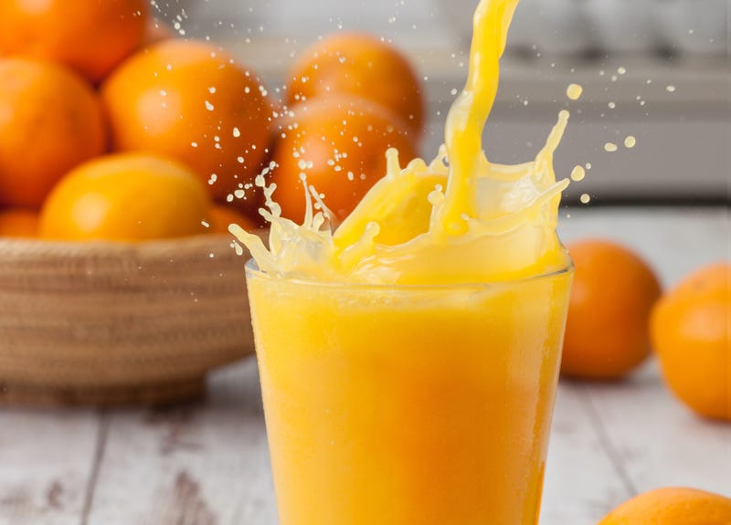 Orange juice poured into a glass. 