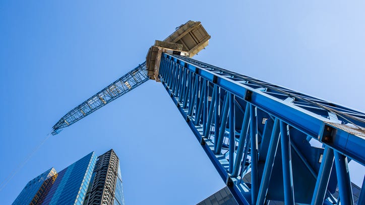 Man under medical evaluation after spending more than 24 hours on crane in West Dallas