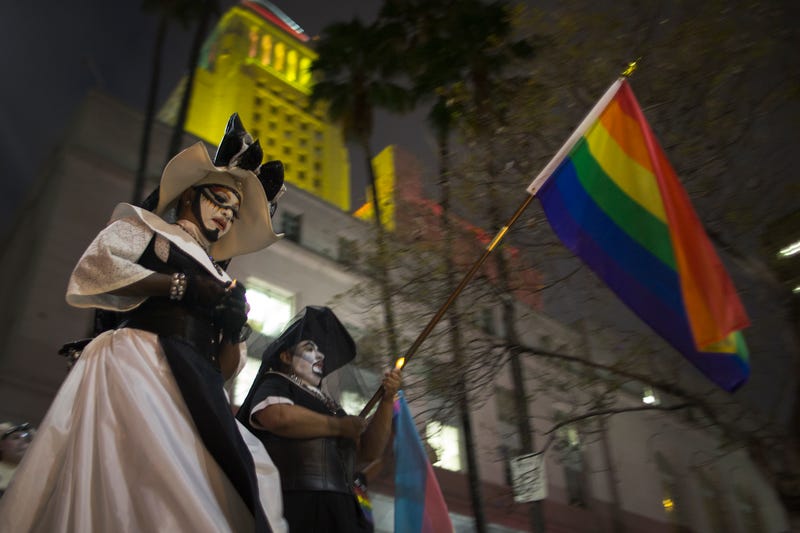 LOS ANGELES, CA - JUNE 13: Members of the Sisters of Perpetual Indulgence lead people on a march around City Hall, which is lit in the colors of the rainbow flag to honor the LGBT victims of the worst mass shooing in United States history, on June 13, 2016 in Los Angeles, United States.