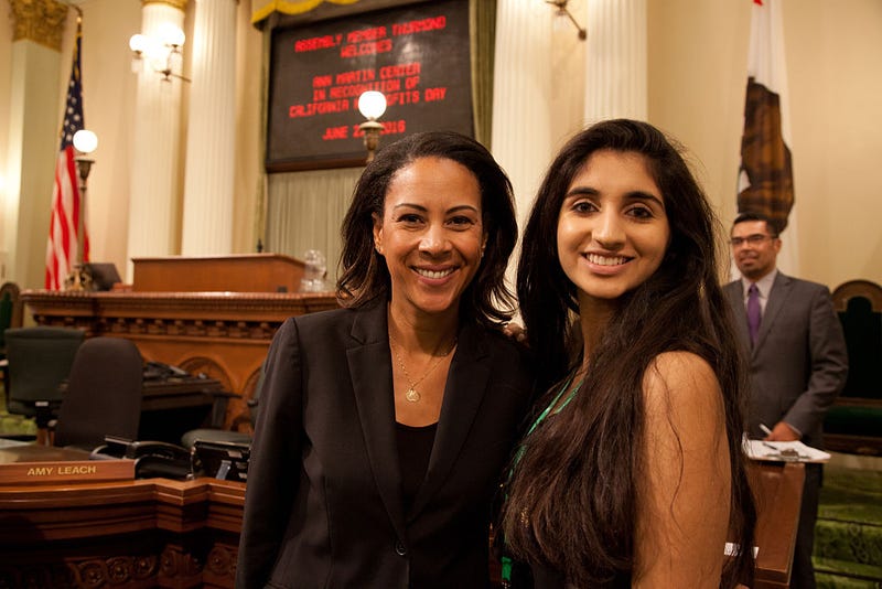Gold Award recipient Inaara Biring (R) of Girl Scouts of Greater Los Angeles poses for a photo with Assembly member Autumn Burke at the California State Capitol.