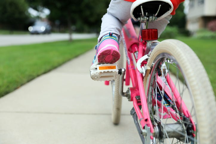child on bike in a stock photo