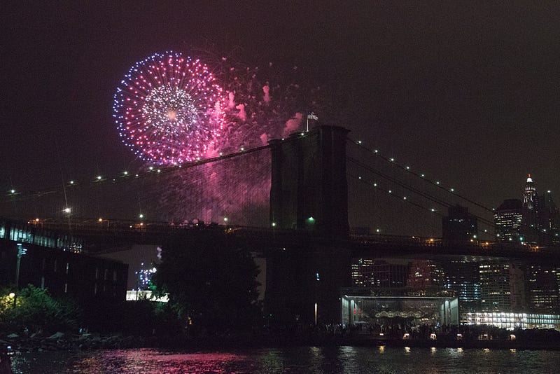 People watch the Macy's Fourth of July Fireworks from Brooklyn Bridge Park on July 4, 2016 in the Brooklyn borough of New York City.
