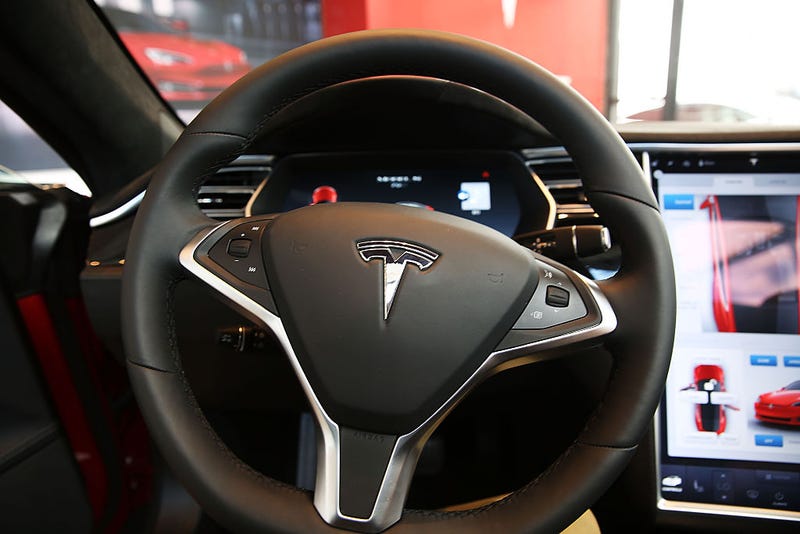 The inside of a Tesla vehicle is viewed as it sits parked in a new Tesla showroom and service center in Red Hook, Brooklyn on July 5, 2016 in New York City. The electric car company and its CEO and founder Elon Musk have come under increasing scrutiny following a crash of one of its electric cars while using the controversial autopilot service. Joshua Brown crashed and died in Florida on May 7 in a Tesla car that was operating on autopilot, which means that Brown's hands were not on the steering wheel. (Photo by Spencer Platt/Getty Images)