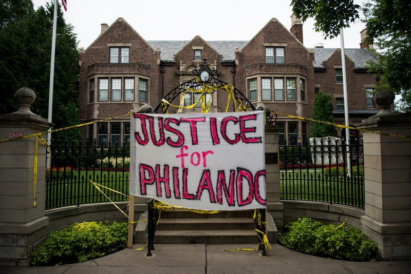 A sign reading, "Justice for Philando," and police tape are draped over the entrance of the Governor's Mansion following the police shooting death of a black man on July 7, 2016 in St. Paul, Minnesota. Philando Castile was shot and killed July 6, 2016, by a police officer in Falcon Heights, MN.