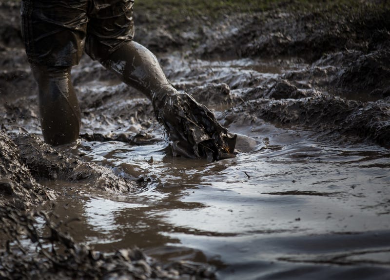 Through the power of a boat and some muscle from first responders, a man was freed from a muddy entrapment after he sunk into chest-deep muck in West Michigan.