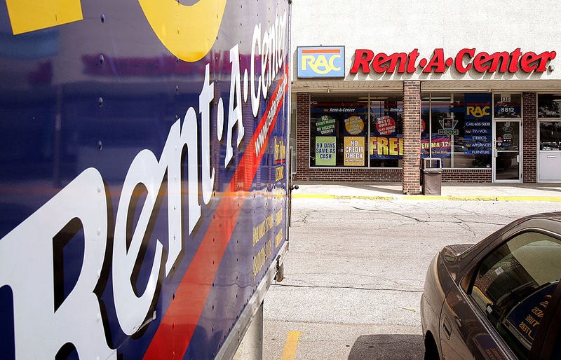 Rent-a-Center signage is seen on a truck parked outside its store September 8, 2005 in Niles, Illinois.