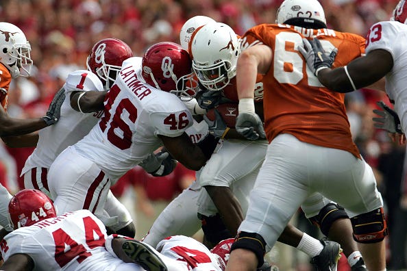 DALLAS - OCTOBER 8: Running back Jamaal Charles #25 of the Texas Longhorns breaks away from Zach Latimer #46 of the Oklahoma Sooners and runs for a touchdown on October 8, 2005 at the Cotton Bowl in Dallas, Texas.