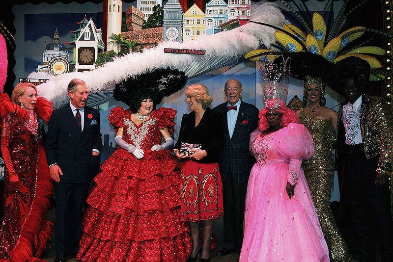 Prince Charles, Prince of Wales (2nd from L) and Camilla, Duchess of Cornwall (C) meets the cast at a performance of Beach Blanket Babylon November 6, 2005 in San Francisco.