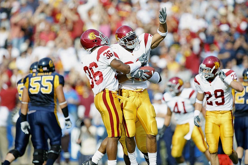 USC Trojans celebrate an interception against the California Golden Bears at Memorial Stadium on November 12, 2005, in Berkeley, California.