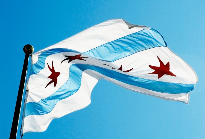 Chicago's flag waves on a sunny day.