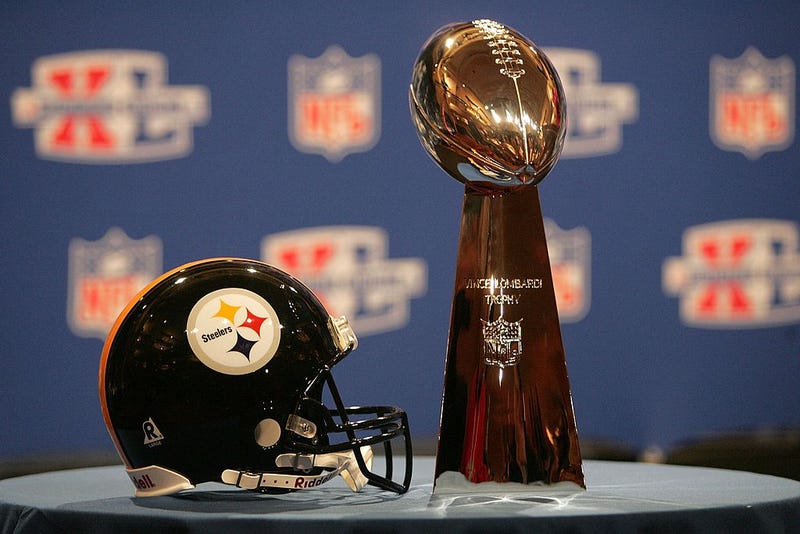 Steelers helmet and Lombardi Trophy