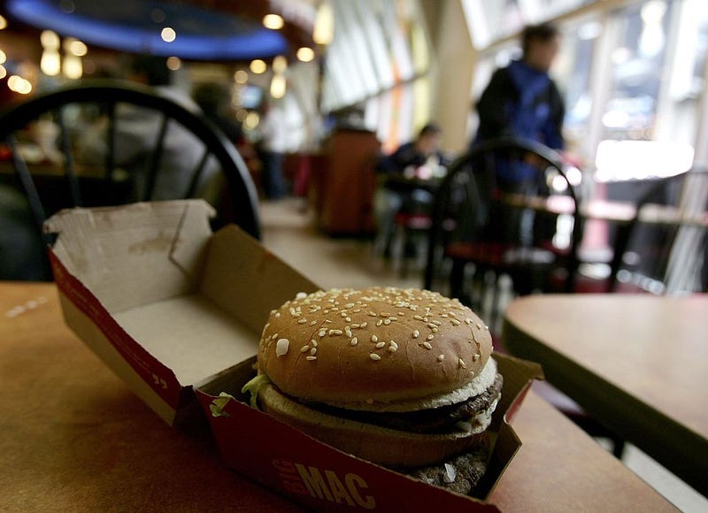 A Big Mac sits at a table at McDonalds