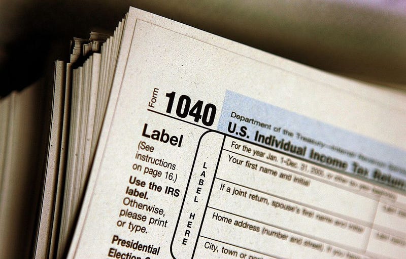 The top of a form 1040 individual income tax return for 2005 is seen atop a stack on the same at the Des Plaines Public Library March 23, 2006 in Des Plaines, Illinois.