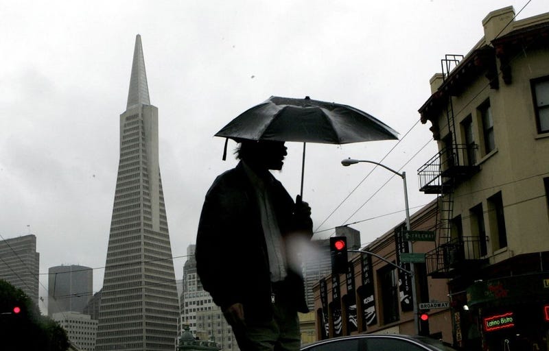 A man walks in the rain near the Transamerica Pyramid building March 31, 2006 in San Francisco, California.