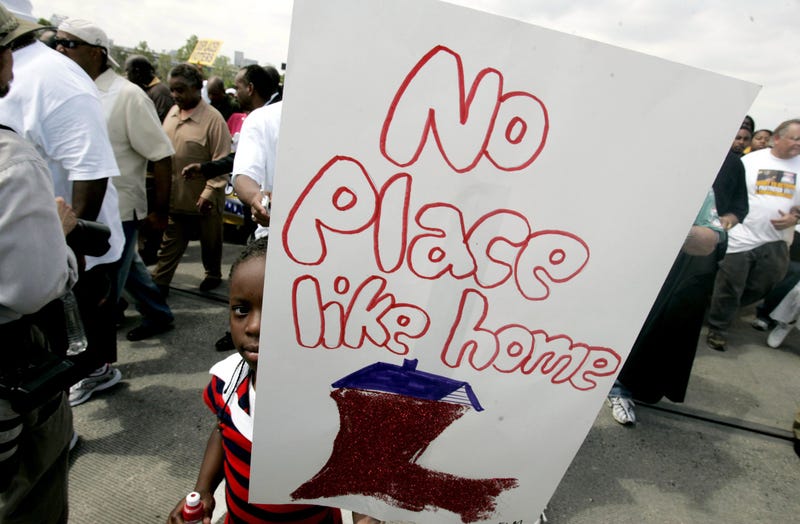 girl holding Louisiana sign