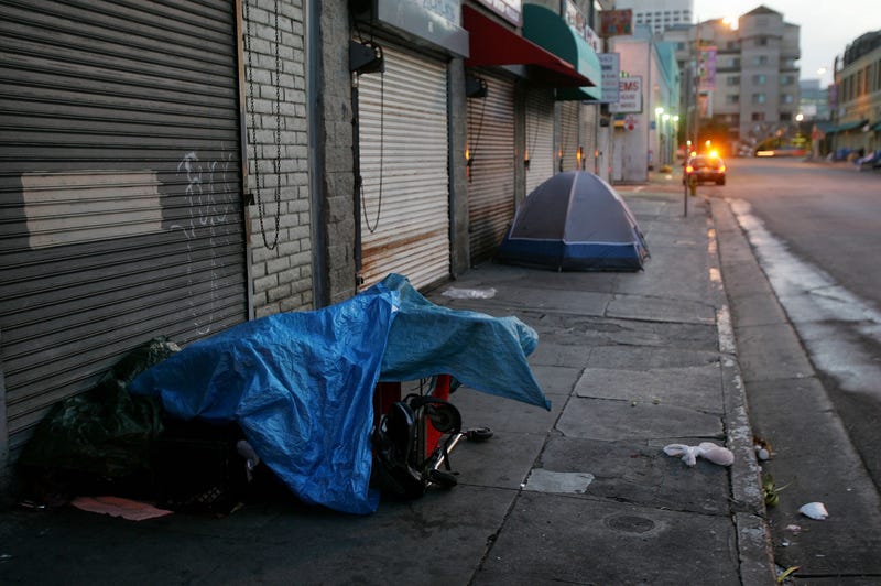 tent and tarps on sidewalk