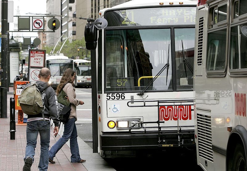 Passengers board a MUNI bus along Market Street April 25, 2006 in San Francisco, California.