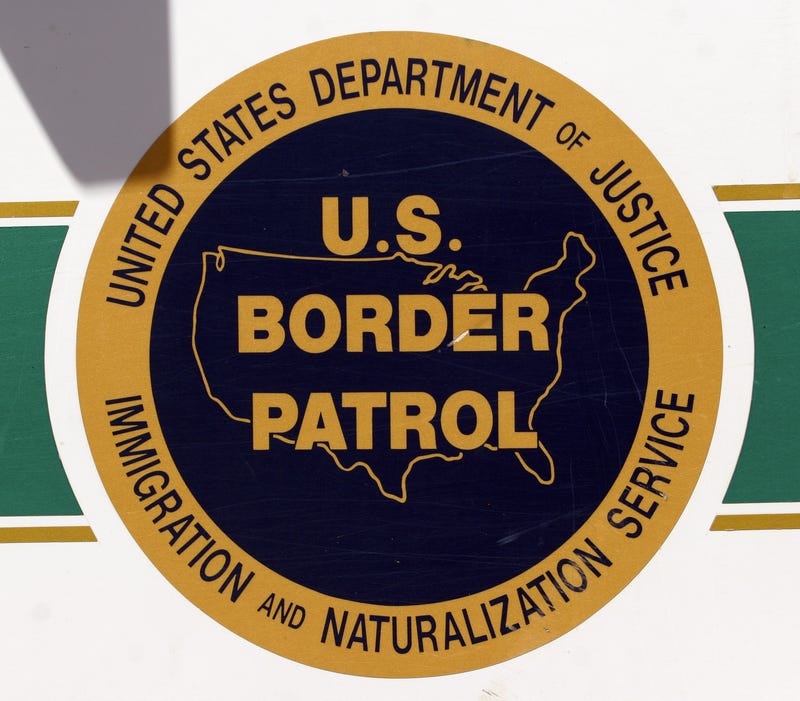  The U.S. Border Patrol emblem is seen on the side of an agent's truck patrolling the border May 14, 2006 in Nogales, Arizona.