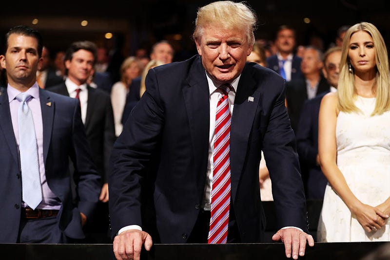 Donald Trump (C) speaks to delegates as Donald Trump Jr. (L) and Ivanka Trump (R) look on during the third day of the Republican National Convention on July 20, 2016 at the Quicken Loans Arena in Cleveland, Ohio. 