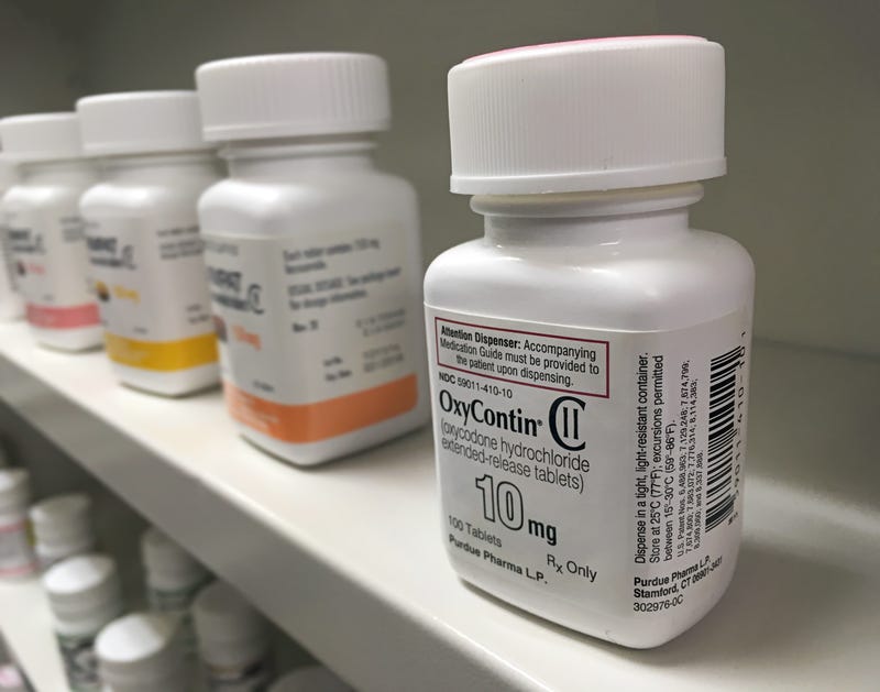 Oxycontin bottle on shelf. 