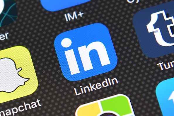 The LinkedIn app logo is displayed on an iPhone