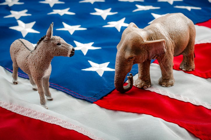 Republican elephant and Democratic donkey facing off. 