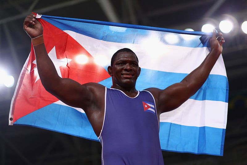 Mijain Lopez Nunez of Cuba celebrates victory over Riza Kayaalp of Turkey in the Men's Greco-Roman 130 kg Gold Medal bout on Day 10 of the Rio 2016 Olympic Games