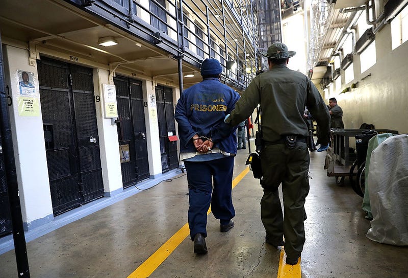 A San Quentin correctional officer has been charged for allegedly conspiring to smuggle phones to inmates.
