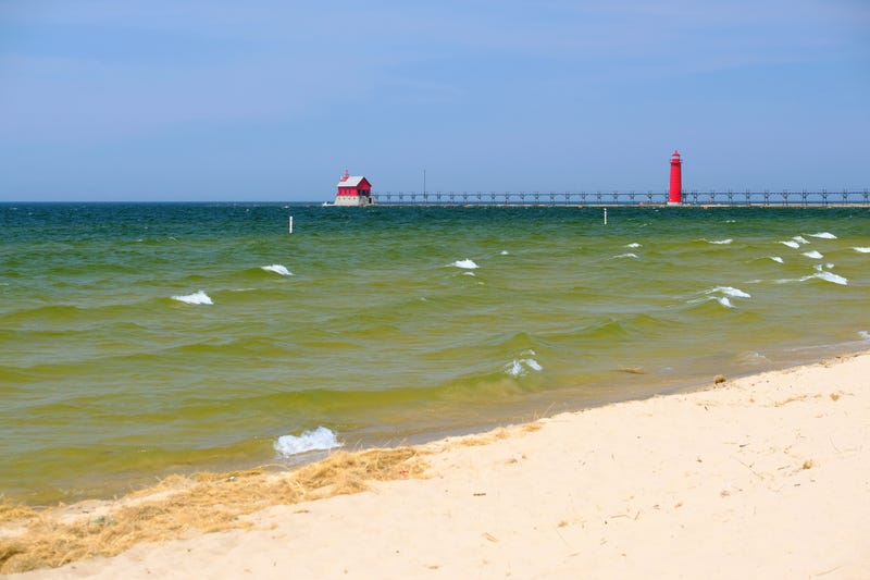 A bunch of drunk beach goers spoiled holiday fun for many as authorities were forced to clear parts of a popular West Michigan beach and close its famous pier.