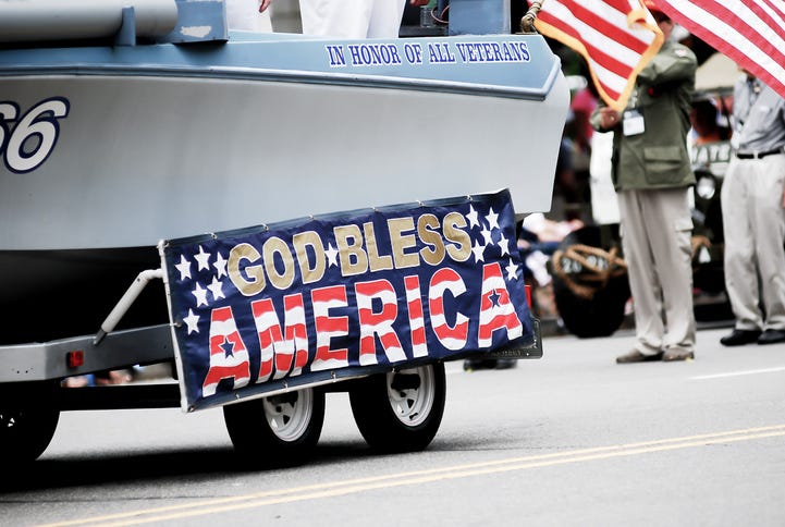 "God bless America" banner in parade