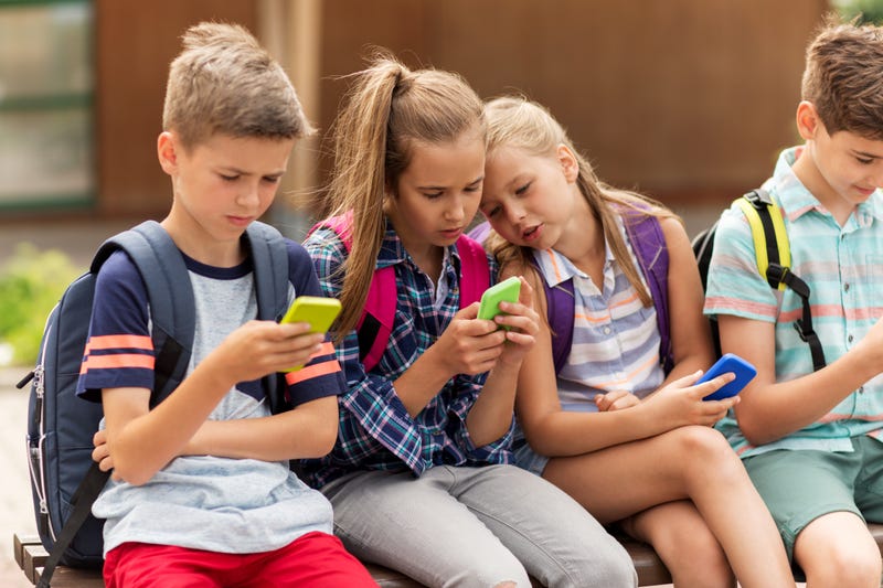 Kids on cell phones