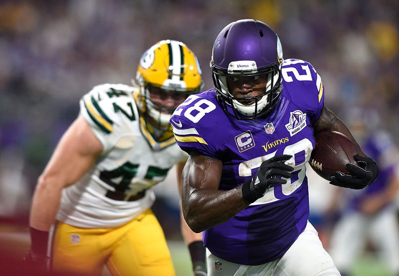 Adrian Peterson #28 of the Minnesota Vikings carries the ball as defender Jake Ryan #47 of the Green Bay Packers pursues him during their game on September 18, 2016 at US Bank Stadium in Minneapolis, Minnesota.