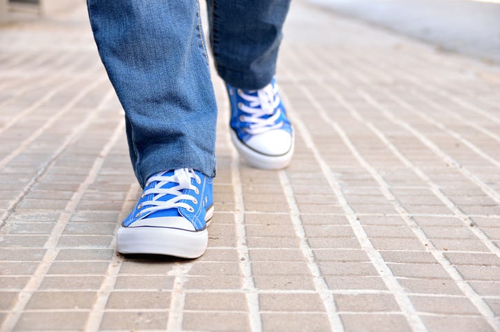 child walking outside