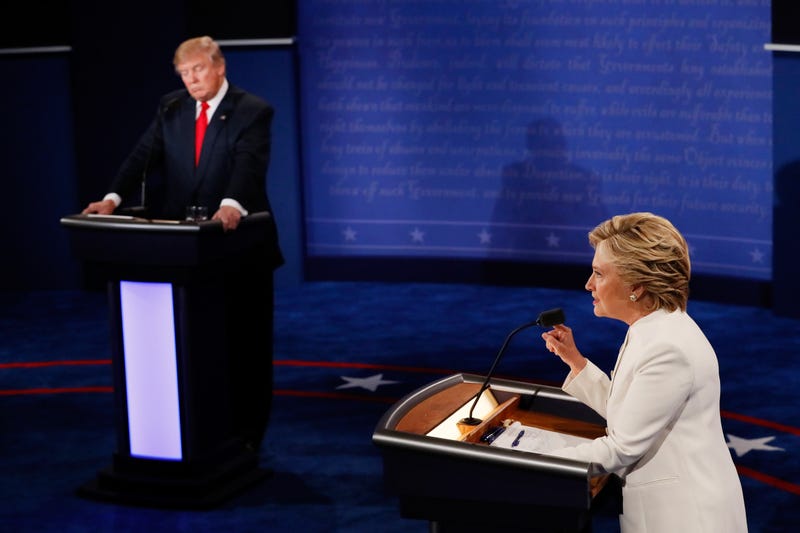 Democratic presidential nominee former Secretary of State Hillary Clinton (R) debates with Republican presidential nominee Donald Trump during the third U.S. presidential debate at the Thomas & Mack Center on October 19, 2016 in Las Vegas, Nevada.