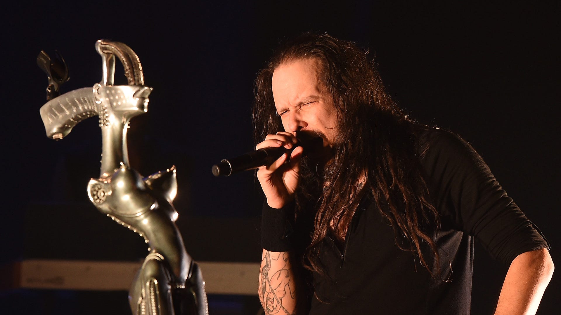 Korn's Jonathan Davis performing seated due to COVID side effects: 'I f***ing refuse to f***ing cancel'