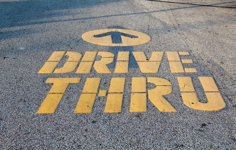 A arrow pointing to the drive thru lane.