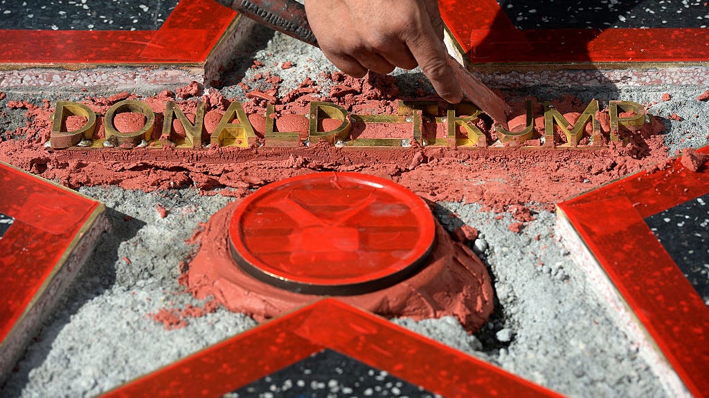 Trump's Walk of Fame star is behind bars, buried under plywood