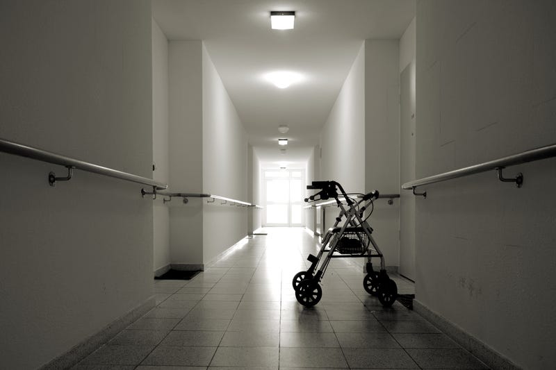 Walker in dimly lit hallway