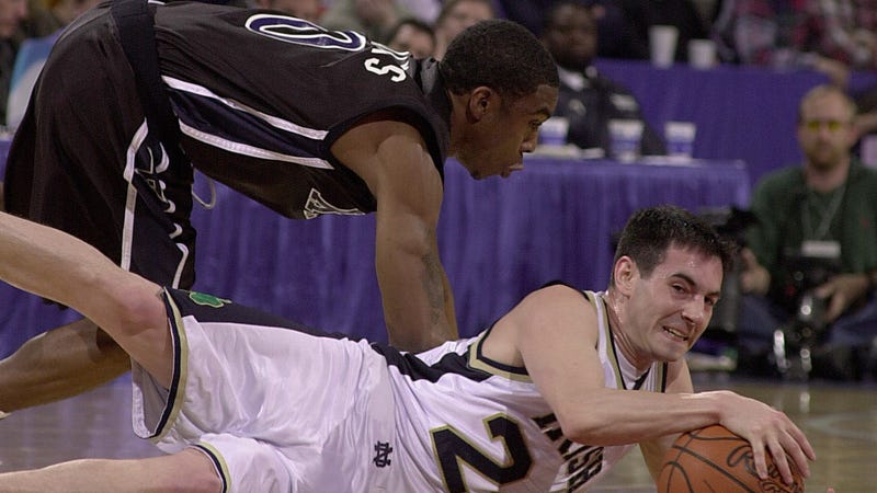 Martin Ingelsby of Notre Dame recovers the loose ball as Lionel Chalmers of Xavier defends during the first round of the 2011 NCAA Men's College Basketball Championship at Kemper Arena in Kansas City, Missouri. 