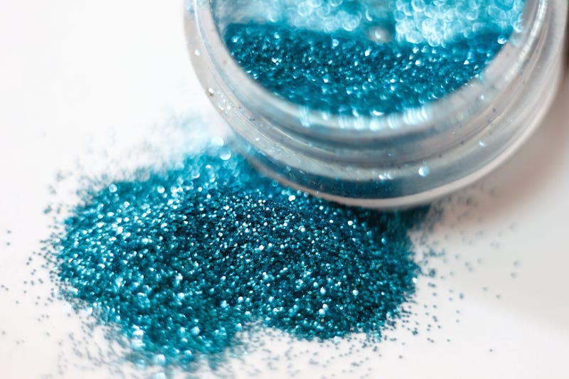 blue glitter spilled from container