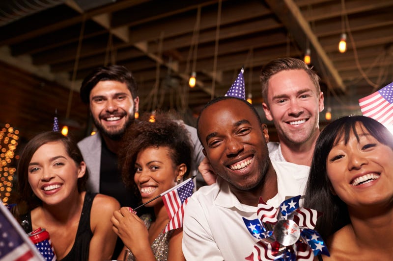 Friends with US flags at a 4th July party