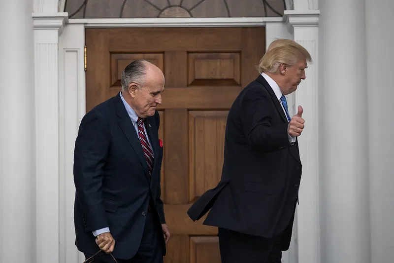Rudy Giuliani and Donald Trump head into the clubhouse for their meeting at Trump International Golf Club, November 20, 2016 in Bedminster Township, New Jersey. 