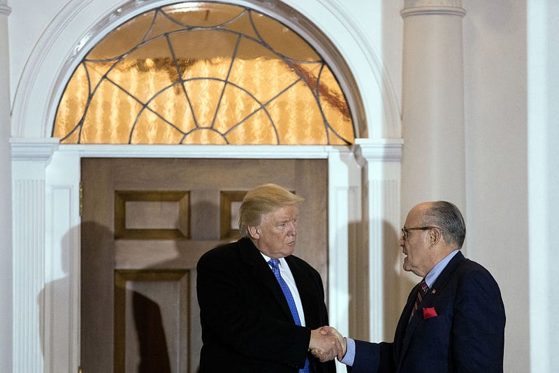 President-elect Donald Trump and former New York City mayor Rudy Giuliani shake hands following their meeting at Trump International Golf Club, November 20, 2016 in Bedminster Township, New Jersey. Trump and his transition team are in the process of filling cabinet and other high level positions for the new administration. (Photo by Drew Angerer/Getty Images)