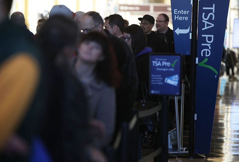Travelers wait in a TSA Pre line for entering security check at Ronald Reagan Washington National Airport November 23, 2016 in Arlington, Virginia.
