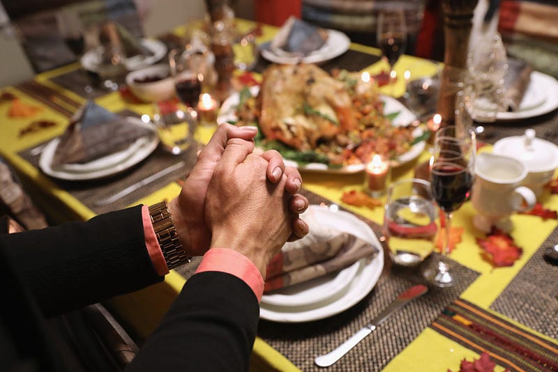 Central American immigrants and their families pray before Thanksgiving dinner on November 24, 2016 in Stamford, Connecticut.