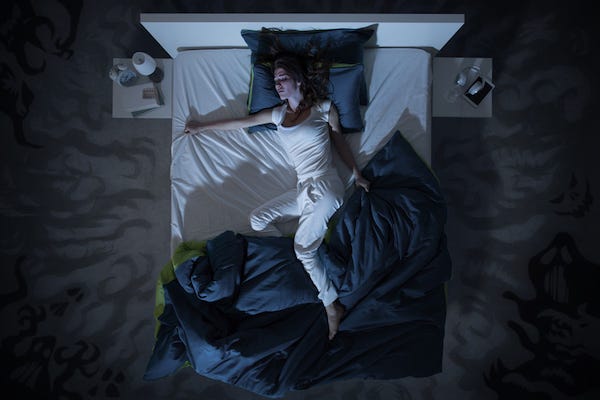 Restless woman sleeping at night