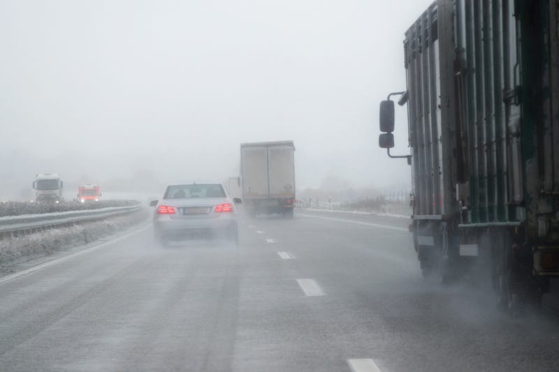 Cars and trucks driving on icy roads.