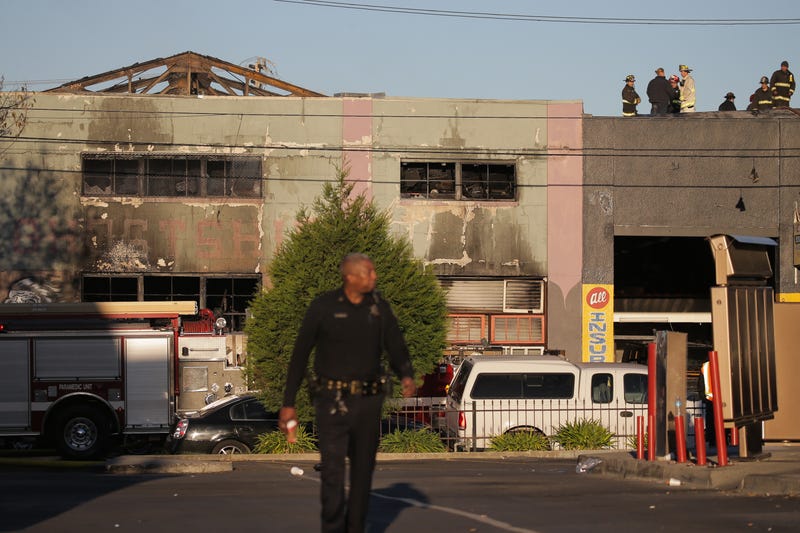 Firefighters and police at the scene of the fire that claimed the lives of 36 people at a warehouse in the Fruitvale neighborhood on December 3, 2016 in Oakland, California.