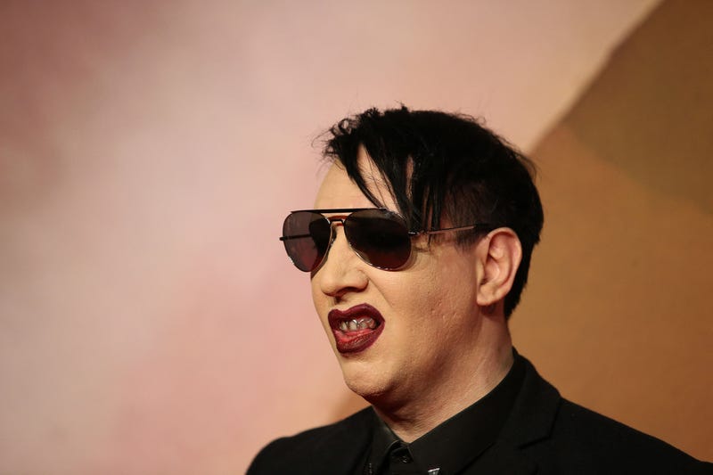 Marilyn Manson poses for pictures on a red carpet in December 2016.