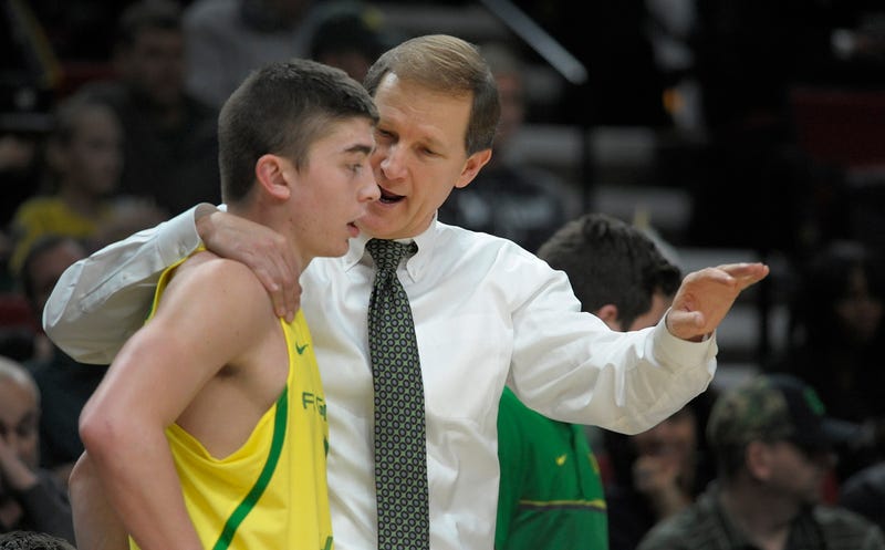 Head coach Dana Altman of the Oregon Ducks speaks with Payton Pritchard #3 during the second half of the game against the UNLV Rebels at Moda Center on December 17, 2016 in Portland, Oregon.The Ducks won the game 83-63